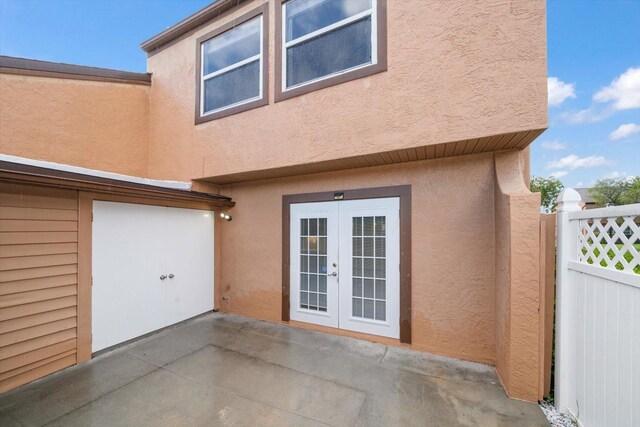 back of house featuring a patio area and french doors