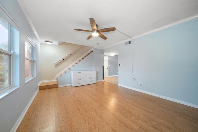 bonus room featuring ceiling fan, a healthy amount of sunlight, and light hardwood / wood-style floors