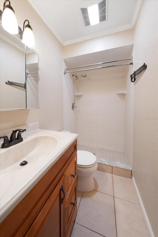 bathroom with a tile shower, oversized vanity, toilet, and tile floors