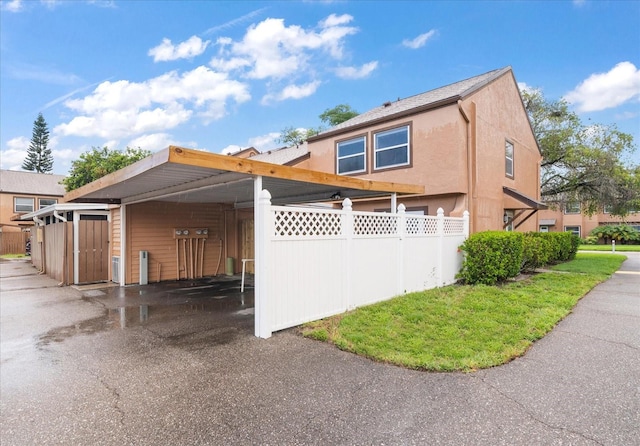 view of front of property with a carport