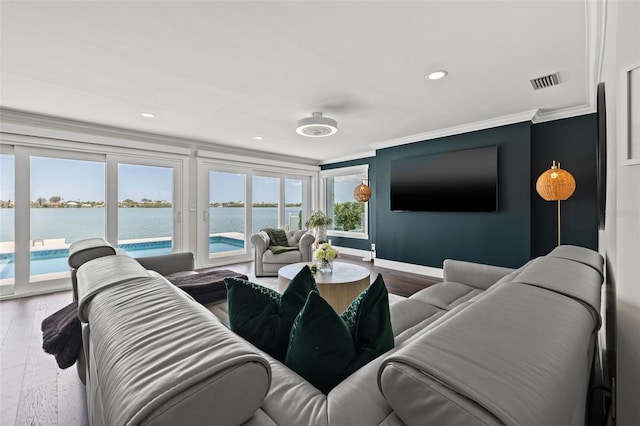 living room with hardwood / wood-style floors and crown molding