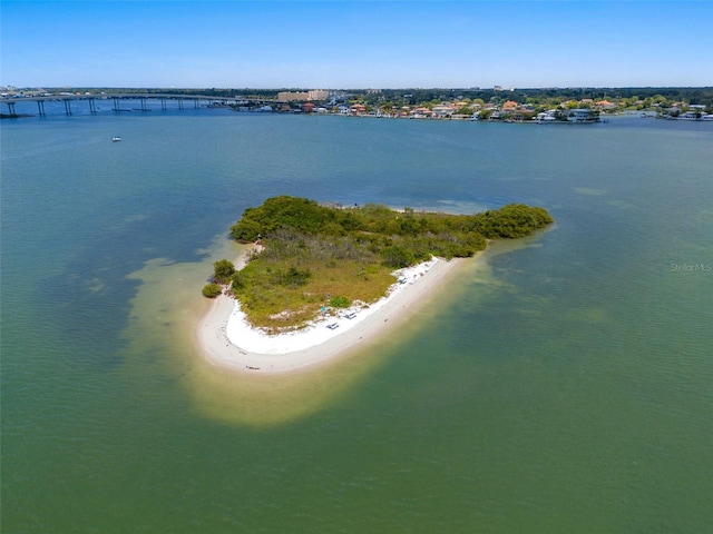 bird's eye view featuring a water view and a view of the beach