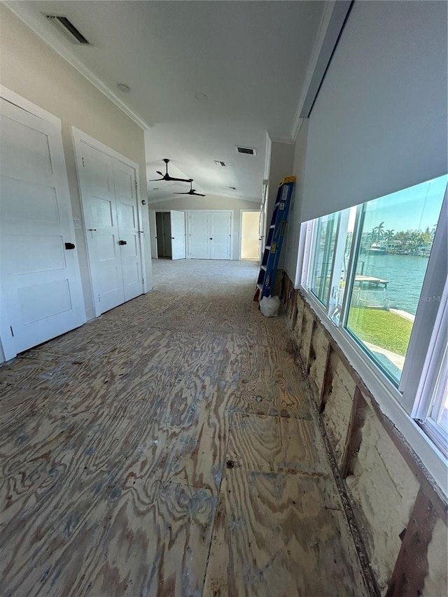 hall featuring a water view and crown molding