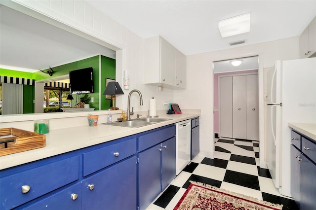 kitchen featuring white cabinets, white appliances, blue cabinets, and sink