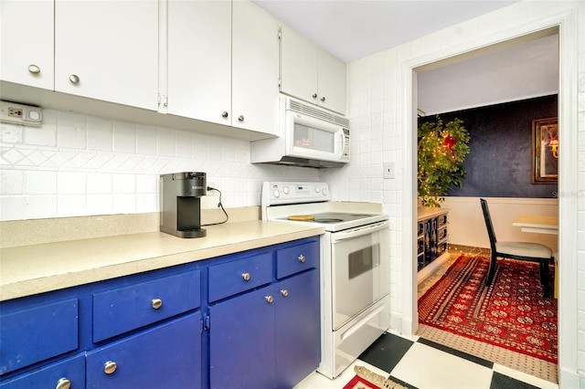 kitchen with white cabinetry, white appliances, and blue cabinets