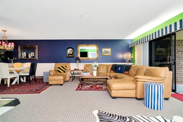 carpeted living room with an inviting chandelier