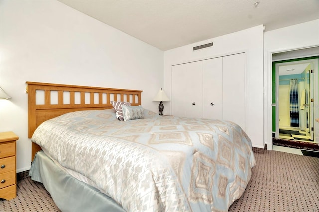 carpeted bedroom featuring a closet