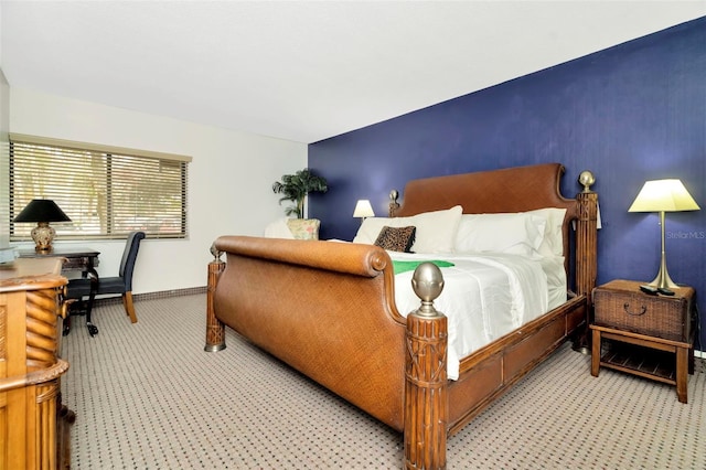 bedroom with light colored carpet