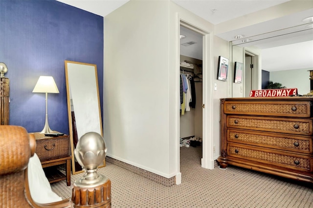 interior space featuring light carpet and a closet