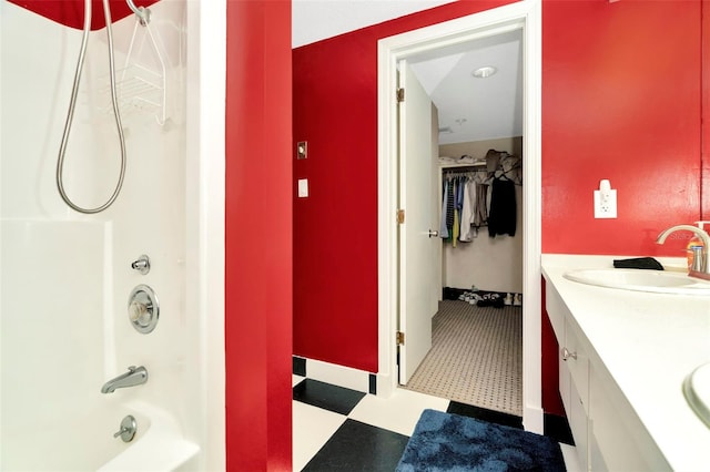 bathroom featuring vanity and shower / bath combination