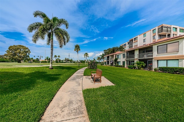 view of property's community with a yard