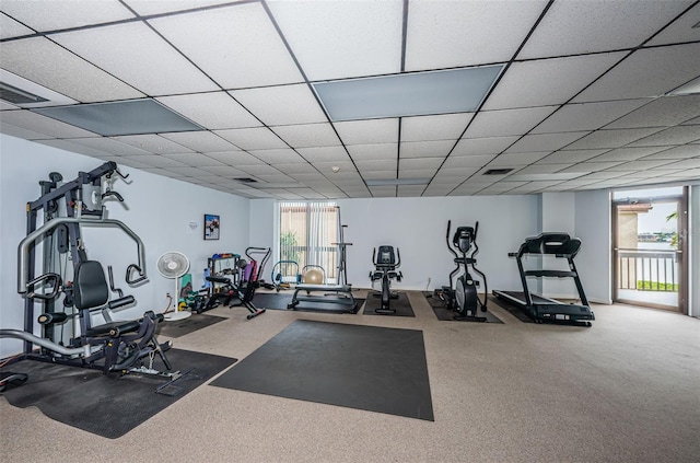 workout area with a wealth of natural light and carpet floors