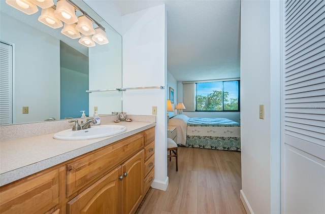 bathroom featuring hardwood / wood-style flooring and vanity