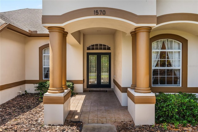 property entrance featuring french doors