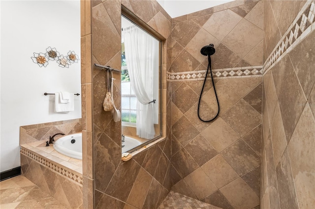 bathroom featuring separate shower and tub