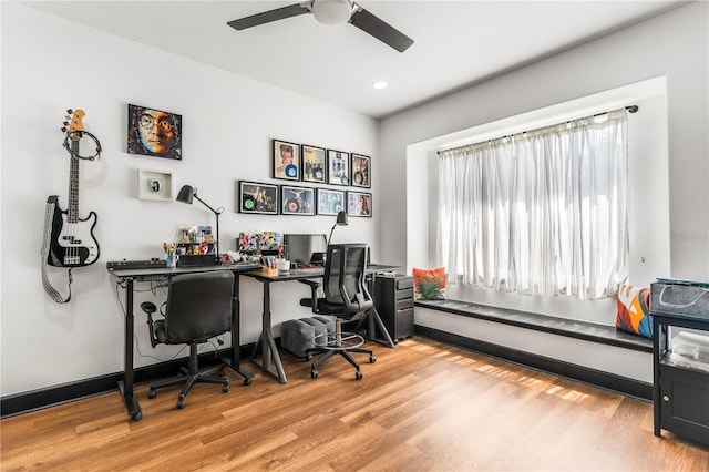 office featuring light hardwood / wood-style flooring and ceiling fan