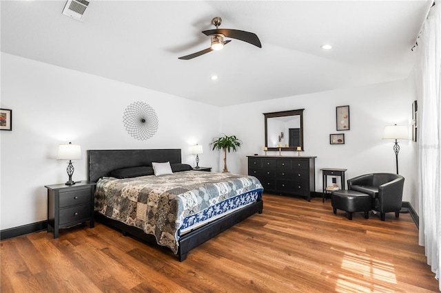 bedroom with wood-type flooring and ceiling fan