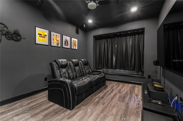 home theater room with hardwood / wood-style flooring