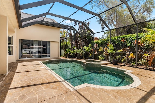 view of swimming pool with a lanai, an in ground hot tub, and a patio