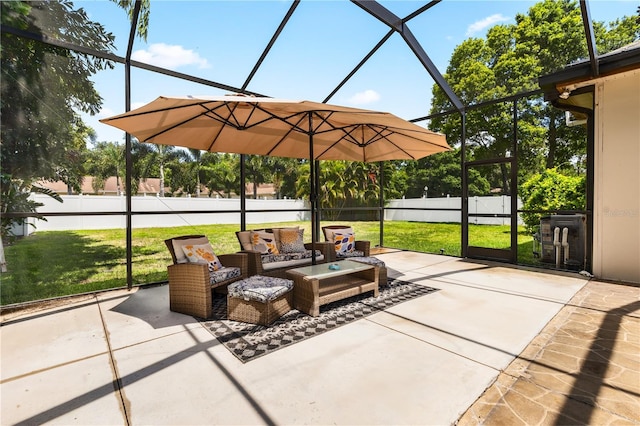 view of patio / terrace featuring outdoor lounge area and glass enclosure