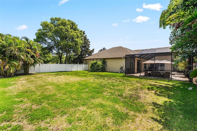 view of yard with a lanai