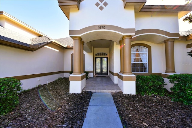 property entrance featuring french doors