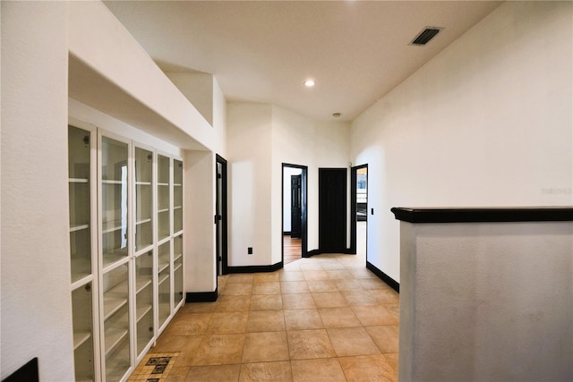 hallway with light tile patterned floors