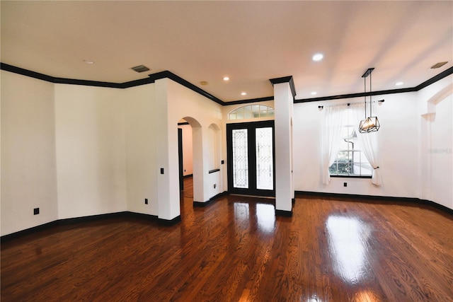 entryway featuring crown molding, dark hardwood / wood-style floors, and french doors