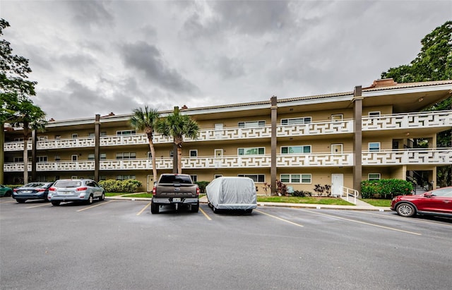 view of property featuring uncovered parking