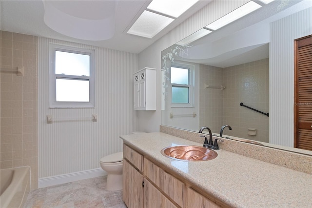 bathroom featuring toilet and vanity