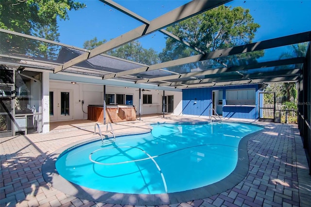 view of swimming pool with a lanai, a bar, and a patio