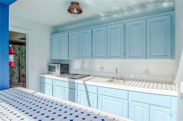 kitchen with sink and white cabinets