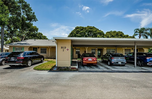 view of parking with a carport