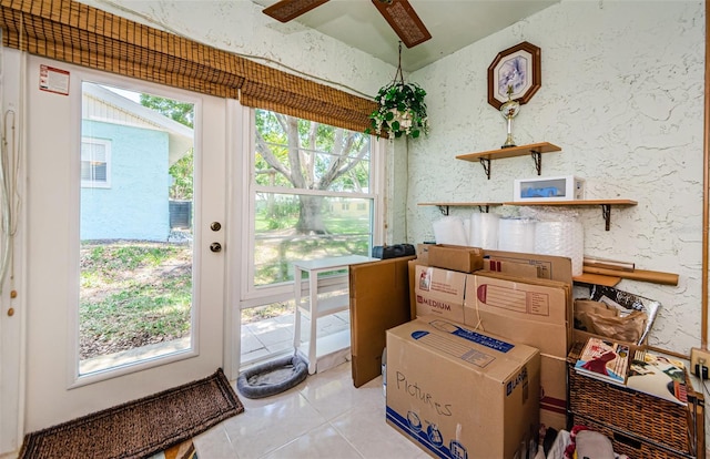 interior space featuring ceiling fan