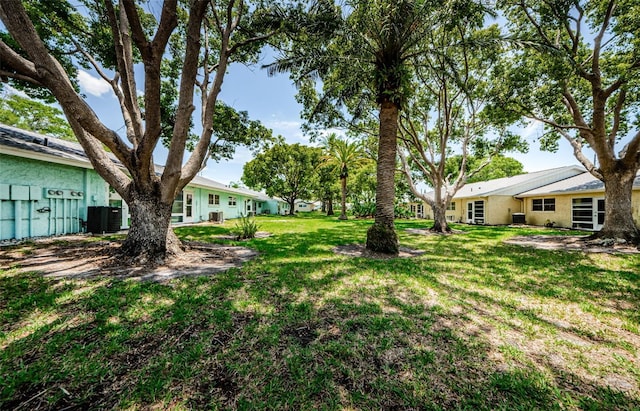 view of yard featuring central AC