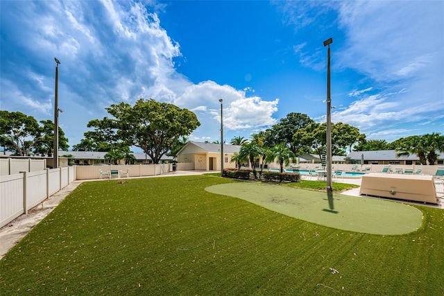 view of yard with a community pool