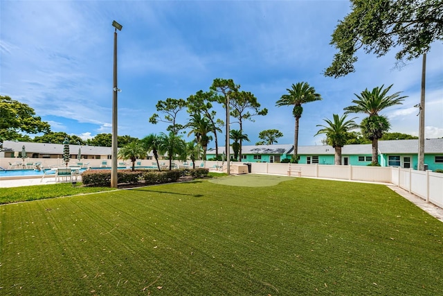 view of yard featuring a community pool