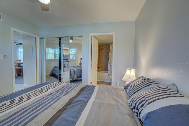 bedroom featuring connected bathroom, ceiling fan, a closet, and a textured ceiling