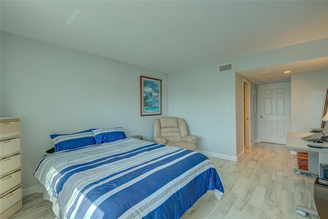 bedroom featuring light hardwood / wood-style floors