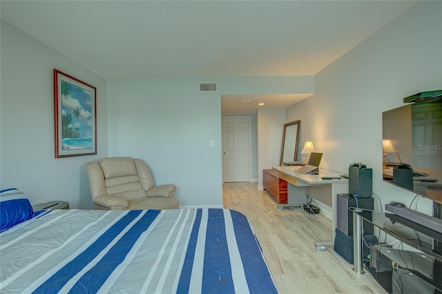 bedroom with light hardwood / wood-style flooring