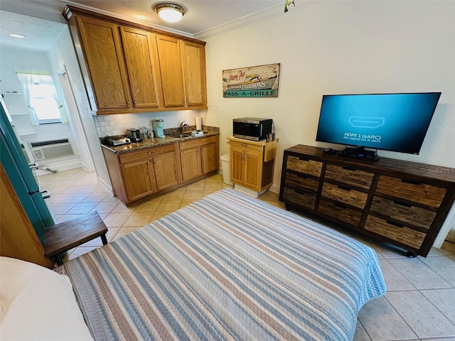 bedroom featuring ornamental molding and light tile flooring