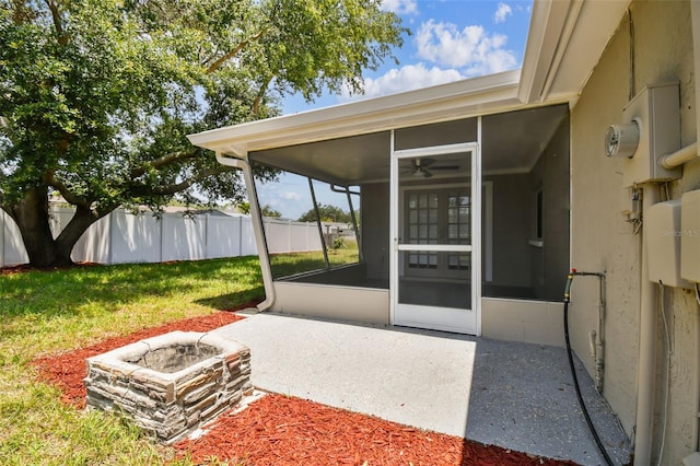 view of patio / terrace featuring a sunroom