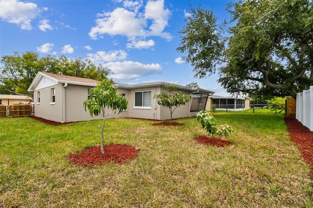 view of yard featuring a sunroom