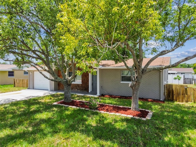 view of front of home with a garage and a front lawn