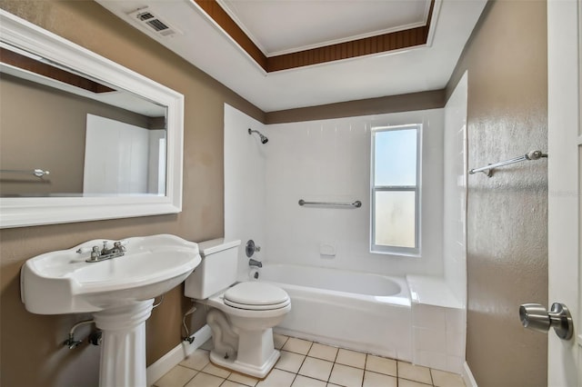 bathroom with tile patterned floors, toilet, and bathing tub / shower combination