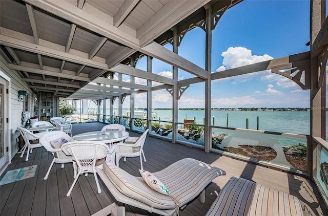 wooden deck featuring a water view