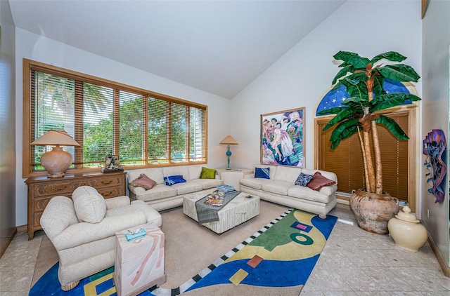 tiled living room featuring high vaulted ceiling