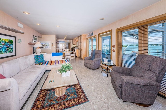 living room featuring light tile flooring