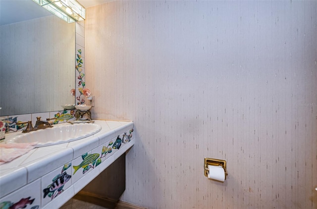 bathroom featuring vanity with extensive cabinet space