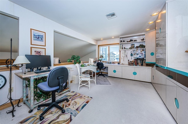 carpeted office space with lofted ceiling